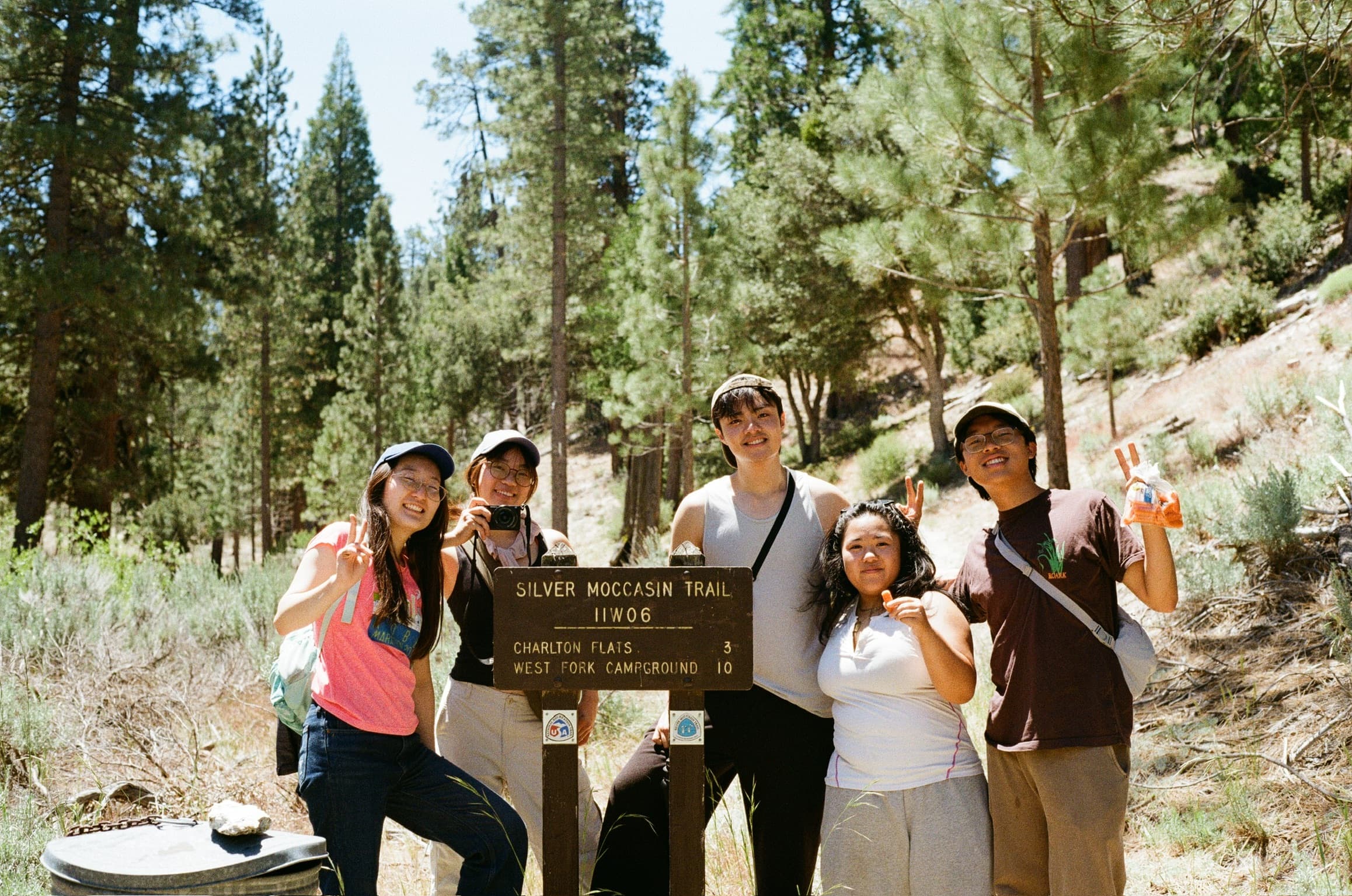 Hiking with friends at a trail sign